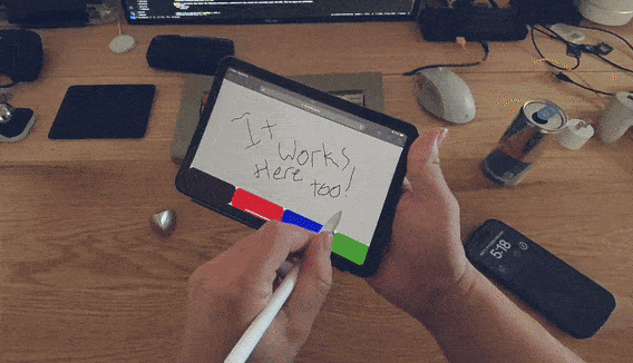 Clip of a user using the same whiteboard app to write on an iPad